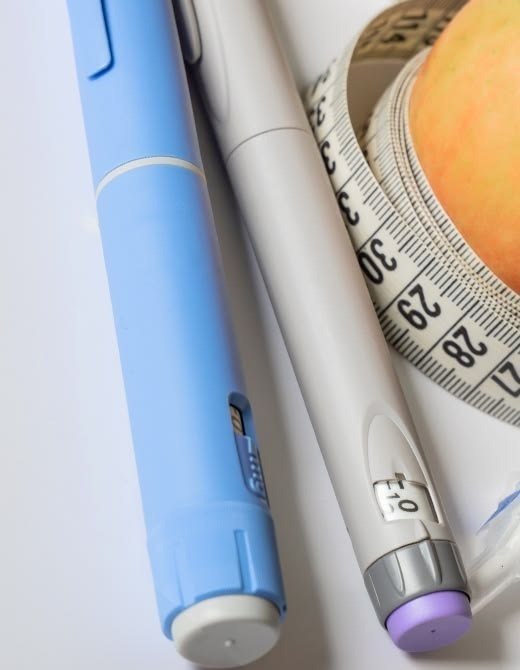 Home Several GLP-1 injection pens side by side, representing a treatment comparison