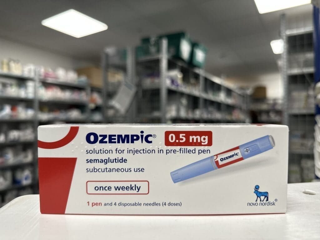 Home Ozempic carton on an Irish pharmacy shelf, representing State reimbursement at the counter