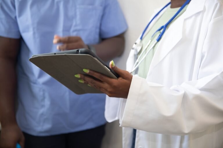 GLP-1 treatment in Ireland, explained Doctor showing patient information during weight loss medication consultation